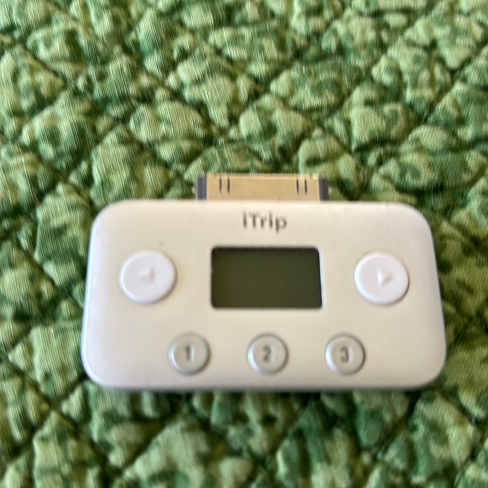 Itrip. Covert your iPod to play through a radio station in your car. .